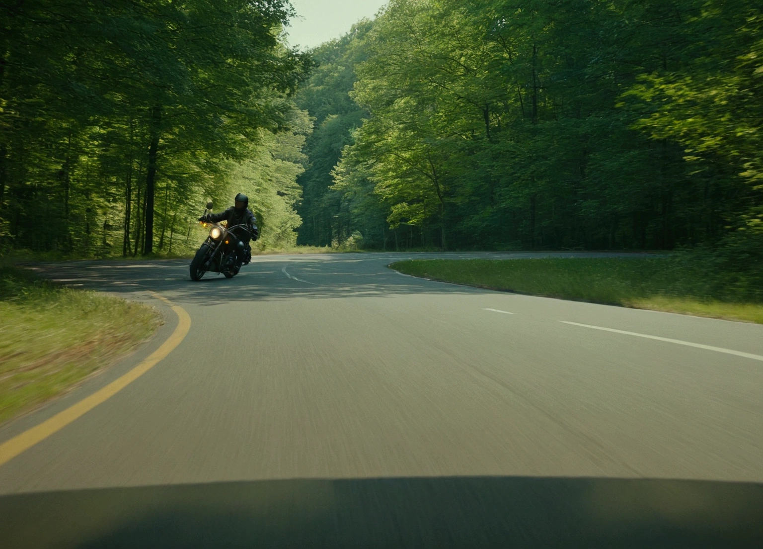 A man rides a motorcycle along a road in the woods, color footage, knight, low quality footage, Movie Stills, Movie Stills, atmospheric warm colorgrade, 1080P, 1 0 8 0 p, color ( sony a 7 r iv, Great composition movie, 2 0 2 1 Movie 4k frame grab