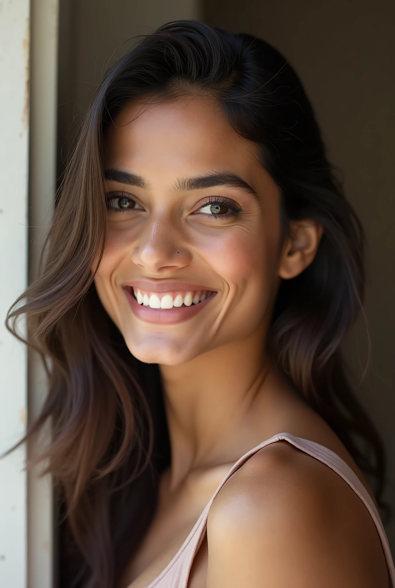 There is a young, Beautiful indian woman, who looks to the future like Katrina Kaif. Smiles into the camera, beautiful teeth. She stands there and looks into the camera, a portrait from raw photo
