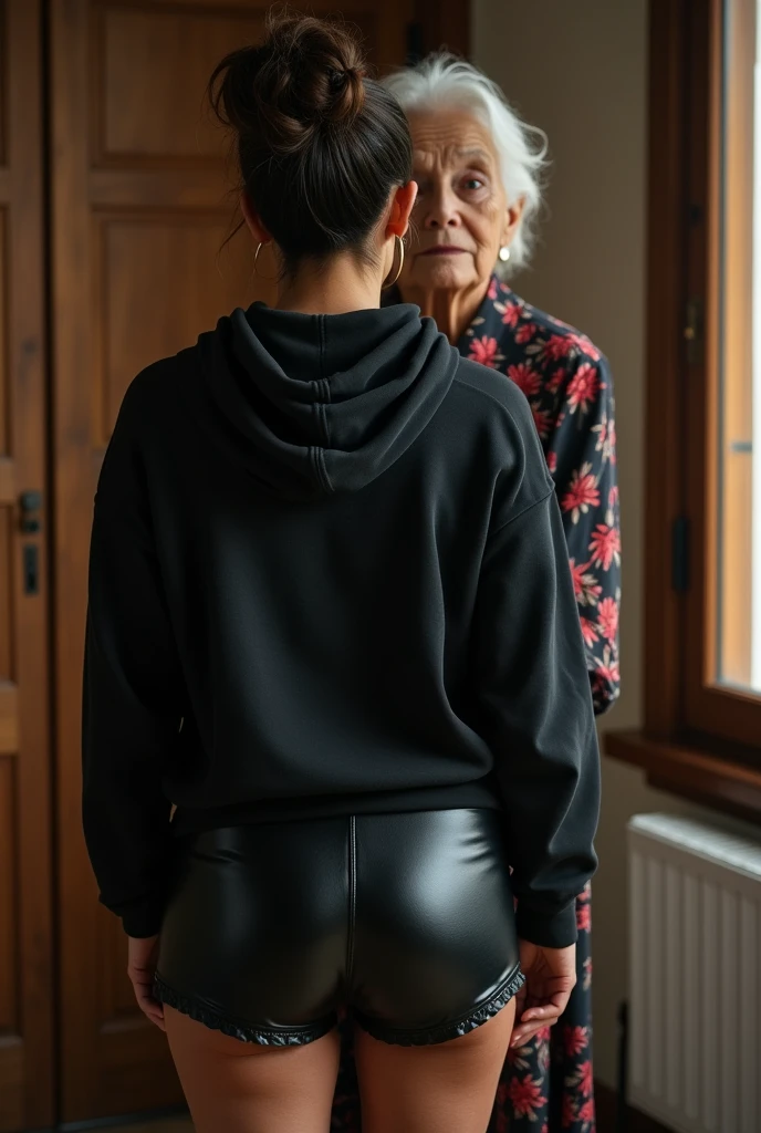 black woman hair in a bun black hoodie black leather short shorts being fucked in the ass by a old grandma in a dress