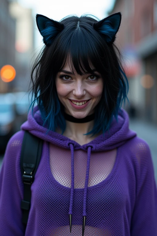 The photo shows a man with shoulder-length black hair, blue inner hair at the back, a purple mesh hoodie, and a cat-like, androgynous appearance, grinning and showing his teeth, as if he was photographed on the street.