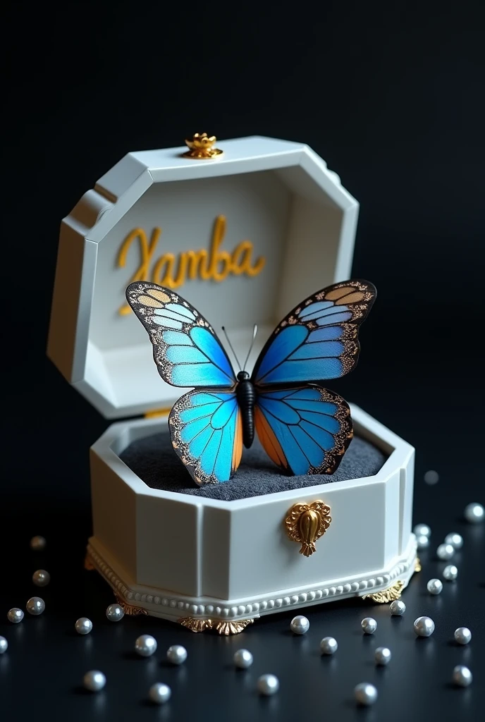 An impressive 3D poster of a white music box, open, against a black background. Inside the box, there is a magnificent blue and silver butterfly, which seems ready to fly away. The lid of the box is adorned with the name "Yamba" in large golden letters. Small, sparkling pearls are scattered around the box