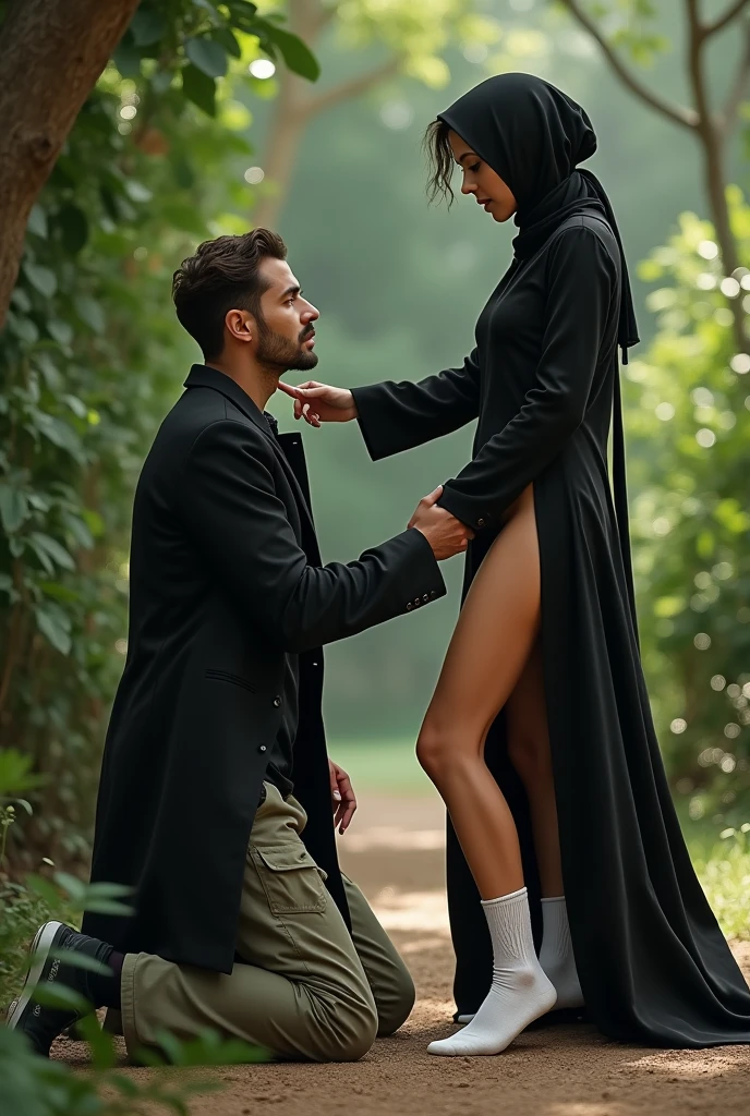 Black long coat and headscarf , white socks, Sexy skinny woman touches man's sweatpants lying on the ground in the garden.
