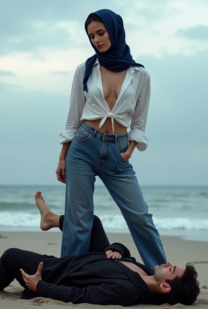 Navy blue headscarf on the beach, Black long coat, barelegged, white shirt, baggy jeans, Sexy skinny woman. Man lying in front of woman. Woman puts her foot on the front of man&#39;s sweatpants. 