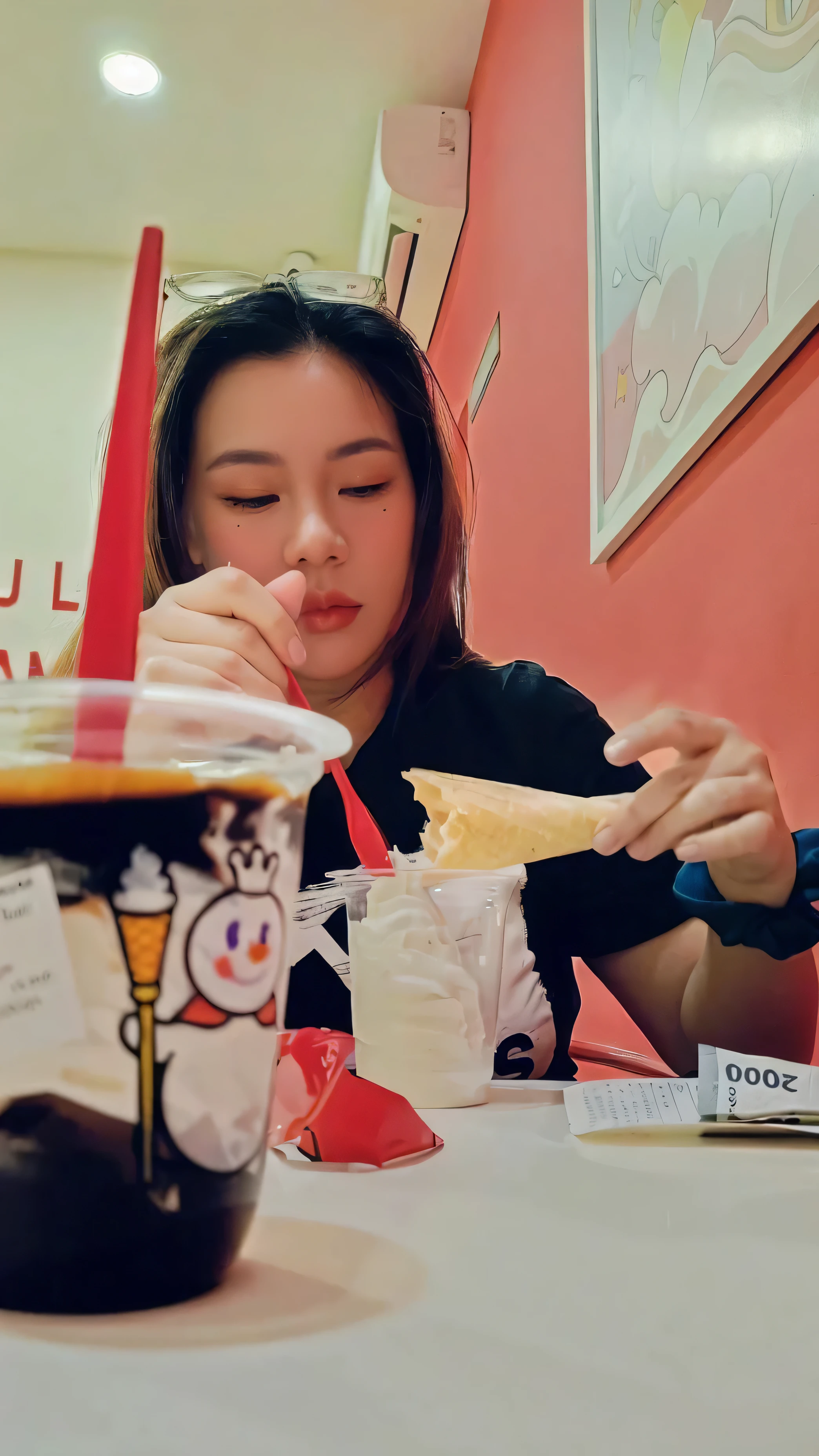 there is a woman sitting at a table with a glass of tea, eating ice - cream, eating ice cream, panting, eating, very funny, with funny feeling, candid shot, semi realism, (((low light))), potrait, candid photo, faridah malik, random artist, during night, protrait, candid picture, ready to eat, really funny