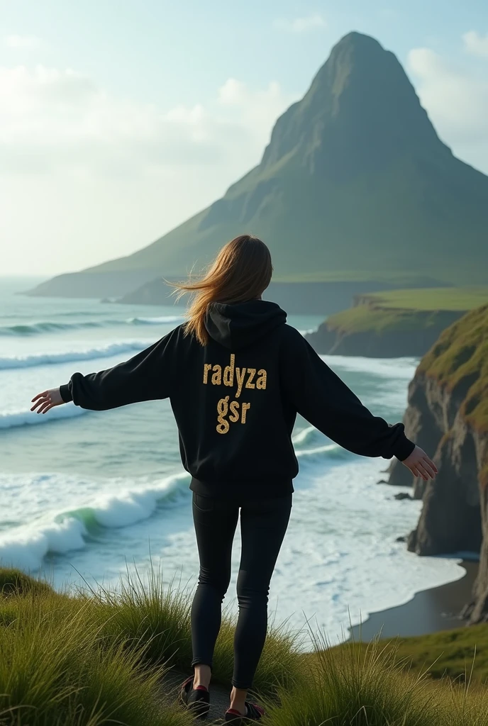 A woman stands on a plateau covered with lush green grass, her back facing the camera. He wore a black hoodie that contrasted with the natural surroundings. On the back of his hoodie, there is luxurious, hining gold writing that reads "RADYZA  GSR" The text stands out, as if exuding elegance amidst the serene landscape. In the distance stretches the vast sea with waves breaking on the rocks. You can see a tall mountain rising majestically, seen from the girl's perspective. At the foot of the mountain you can see standing firmly a line of vague sentences with the words "STARMAKER" in white, with letters designed with a horror theme, adding to the impression of mystery. The girl stared at the mountain in awe, while her arms stretched towards the sky, as if embracing the majesty of nature that lay before her.