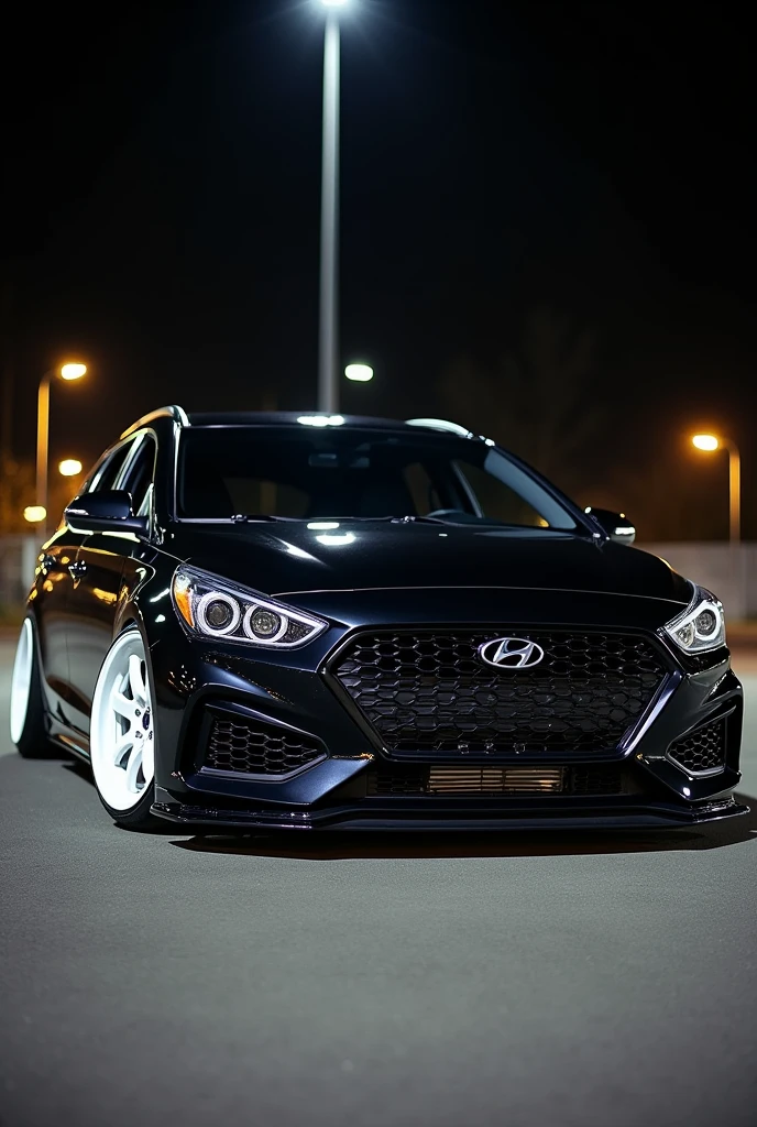 Hyundai i40 2015 station wahon black tuned eith white rims at night with the lights on