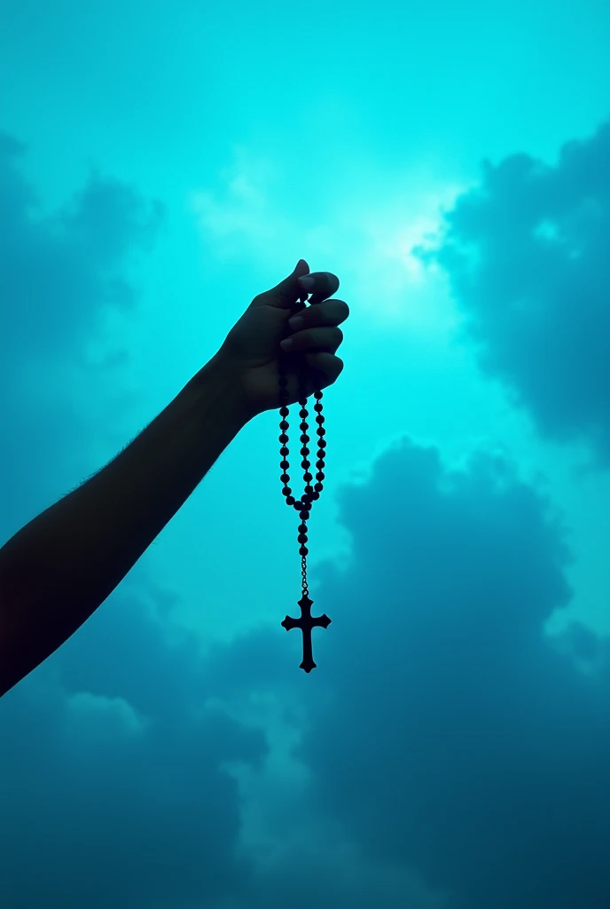 The image shows the silhouette of a hand holding a rosary against a sky with scattered clouds.. The rosary is identified by the specific arrangement of the beads and the cross at the end.. The sky in the background, with its bright blue color and white clouds, creates an interesting contrast, giving the image a serene and possibly spiritual connotation.