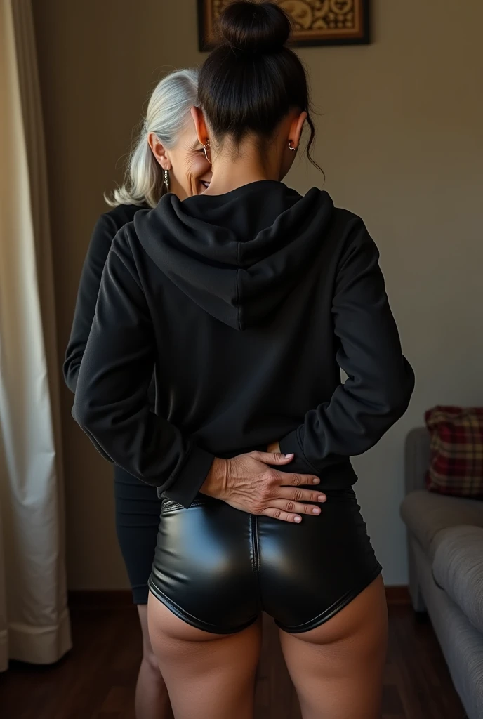 black woman hair in a bun black hoodie black leather short shorts being fucked in the ass by a old grandma in a dress