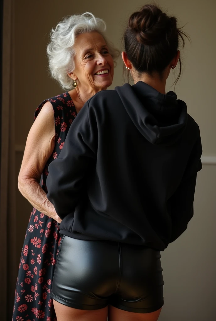 black woman hair in a bun black hoodie black leather short shorts being fucked in the ass by a old grandma in a dress
