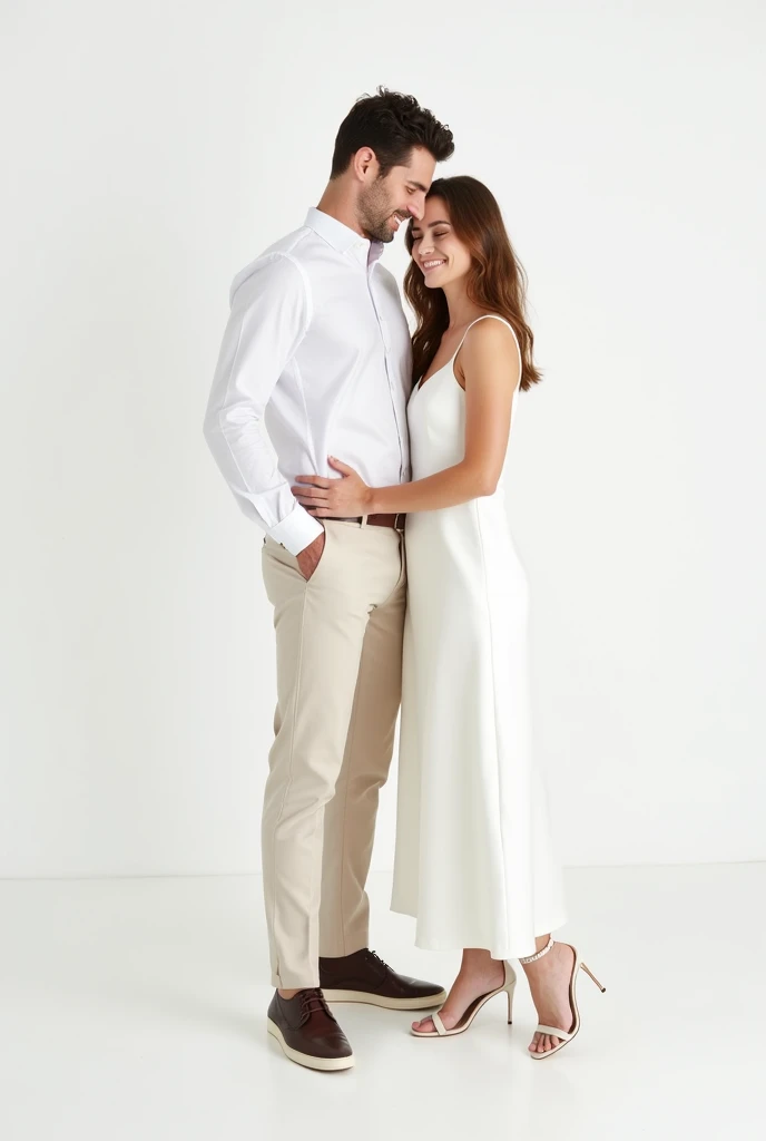 A wedding photo shoot set against a plain white background with no props or additional elements. The bride wears a minimalist white dress from Zara, such as a sleeveless or spaghetti-strap slip dress with a satin or crepe finish. The dress has a clean, elegant silhouette that flows naturally, hitting just above the ankle or at a midi length. Her hair is styled loosely, either left down with soft waves or in a simple, low bun. Her makeup is minimal, emphasizing her natural beauty with a soft glow and neutral tones.

The groom complements her look with a casual yet refined outfit. He wears a crisp white shirt, either tucked into light-colored chinos or paired with slim-fit dark trousers, both options available from Zara. The overall look is polished but relaxed, reflecting the couple's modern and understated style.

In the photo, the couple stands close together, with the groom gently holding the bride's hand or wrapping his arm around her waist. Their expressions are warm and genuine, capturing their natural chemistry. The clean white background highlights the simplicity and elegance of their attire, focusing entirely on their connection and the purity of the moment