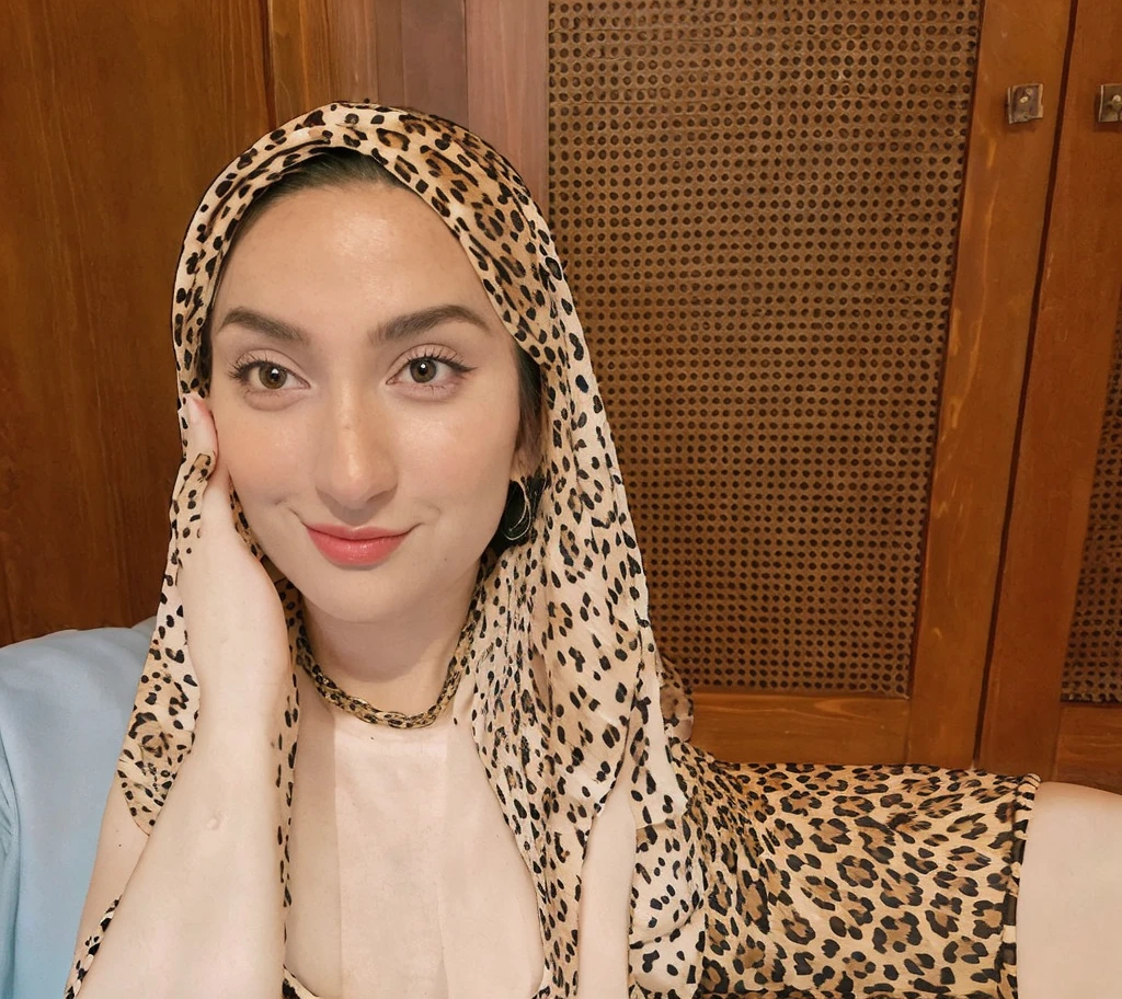 (((Baby Face))), Very cute like a baby face, ((Stylish Hijab)), adorable, 1 girl, , baby face, shy, half body portrait, (face details: 1), (eye details: 1), ((shiny round large breasts, cleavage)). Cute posed. proportional body. Ultra High Res. realistic: 1.4, UHD, ((leopard pattern)), ((angry)(