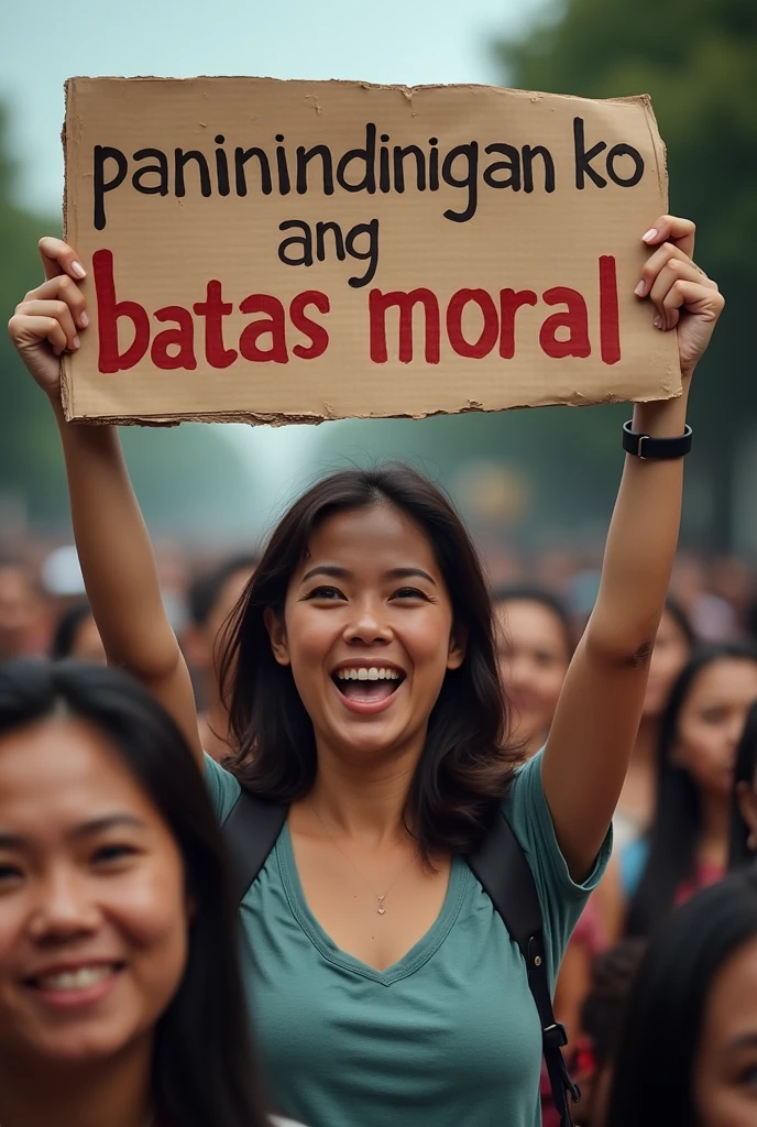 Woman rally with the card board sign that says "paninindigan ko Ang batas moral"