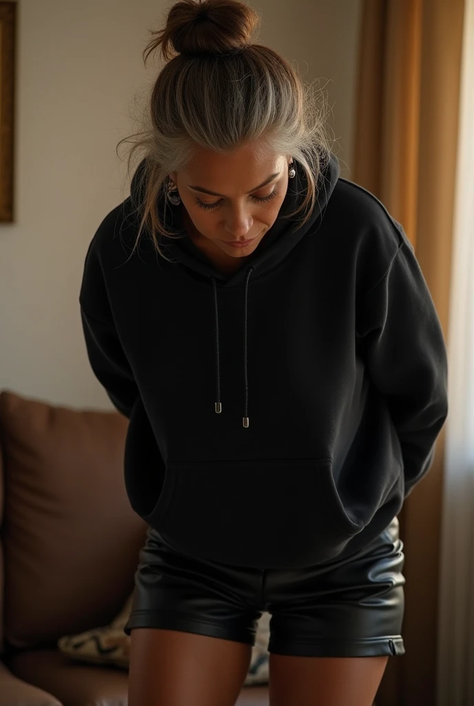 black woman hair in a bun black hoodie black leather short shorts getting fucked in the ass by a old age white grandma in a dress in a living room