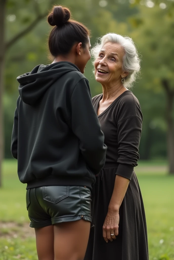 black woman hair in a bun black hoodie black leather short shorts bending over getting fucked in the ass by a old ugly woman in a dress in a park
camera low angle