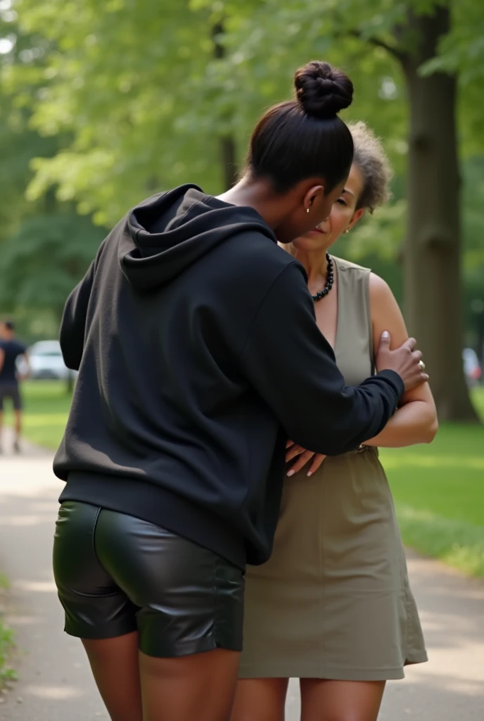 black woman hair in a bun black hoodie black leather short shorts bending over getting fucked in the ass by a old ugly woman in a dress in a park
camera low angle