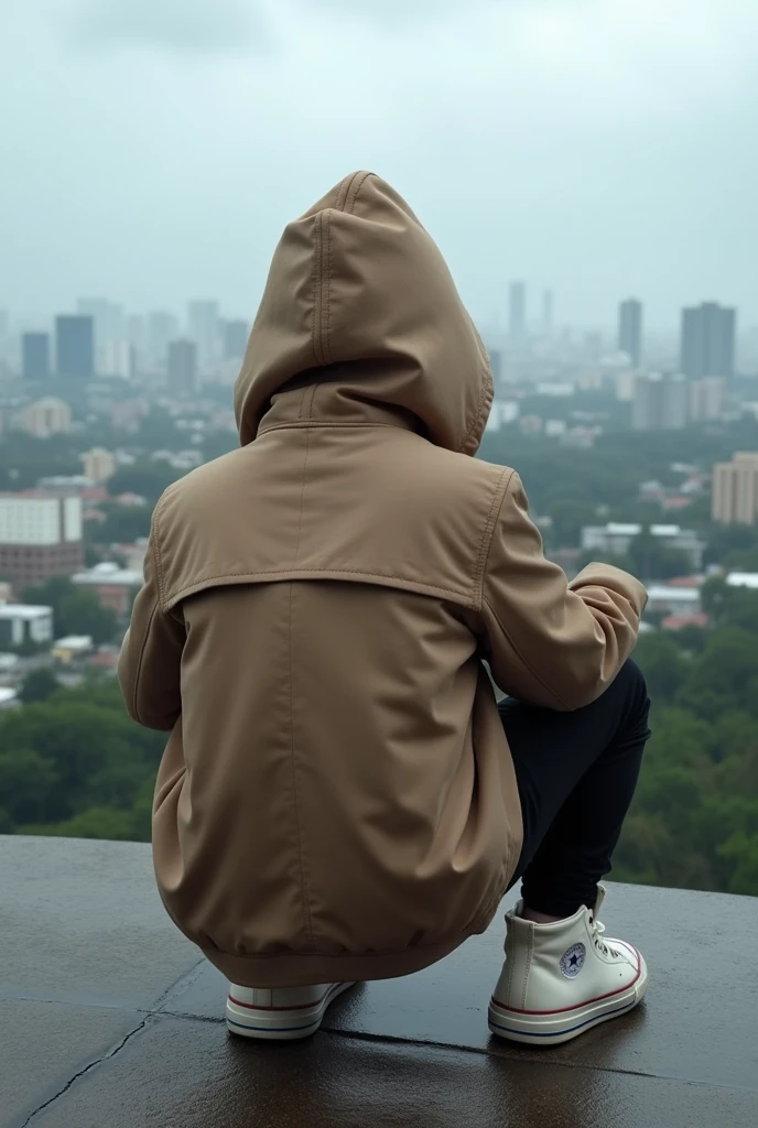 A realistic photo of a hooded boy in a light chocolate coat, and black pants with white high top sneakers completely. Sitting looking at Panama City from Amador. The photo taken from behind the seated person. The weather is cloudy or rainy. Hooded so that nothing can be seen of his head