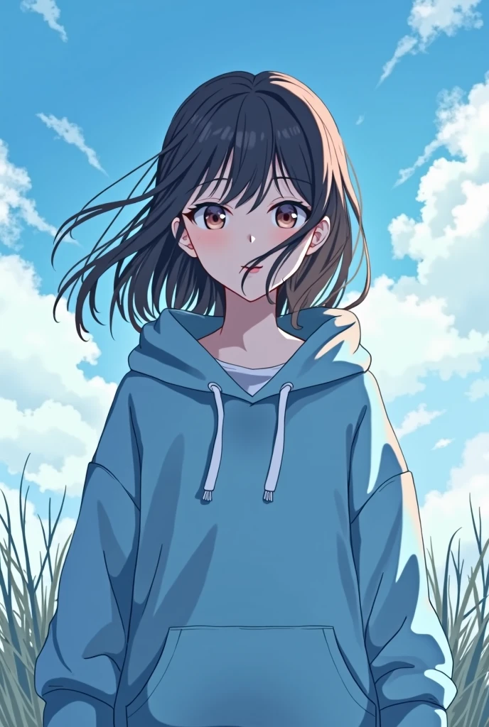 A girl wearing a blue hoodie with a beautiful sky