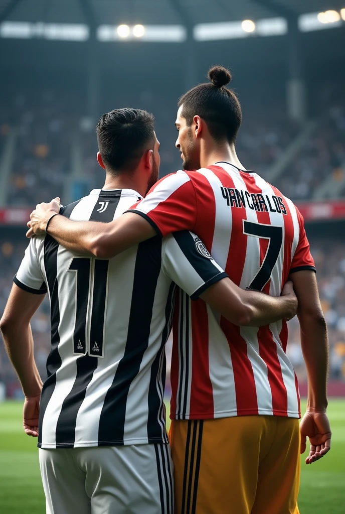 A Juventus player with the name Yan Carlos on his back with the number 11 and Cristiano Ronaldo with the number 7 hugging shoulder to shoulder
