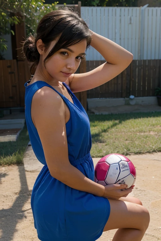  girl playing with a ball in a short dress