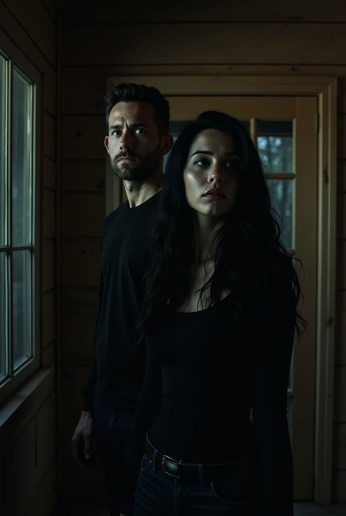 A black-haired woman and a man hear a scream in a room inside the cabin