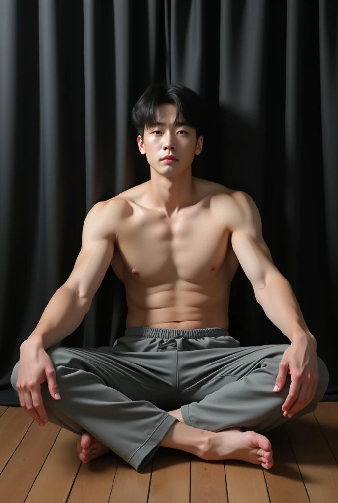 Arafed 25 Korean man, white skin, muscular body, sitting on wooden floor of living room with black curtain curtains background. Legs are wide open in a cross legs with dick highlighted from full gray lower. hands are also wide open, black eyes. Make it the whole picture so much realistic. Upper camera angle ,