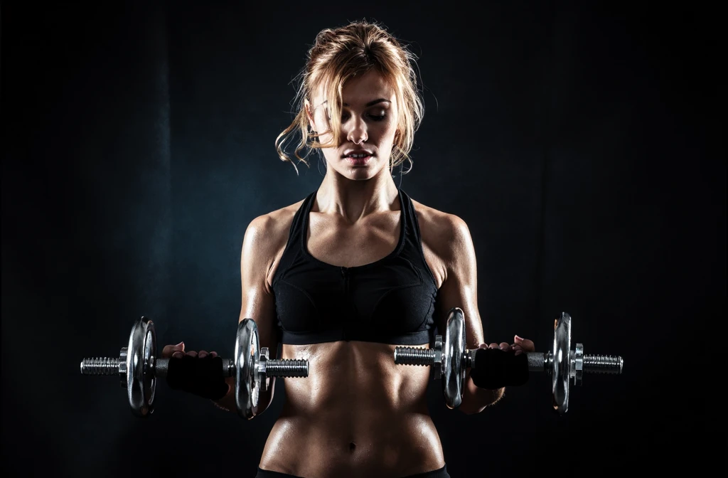 female teenager, long flaming red hair, smiling brightly, gym clothes, dumbbell exercise pose, full body, photorealistic, realistic lighting, highly detailed, 8k, exquisite, vibrant colors, natural skin tones, beautiful eyes, beautiful lips, dynamic pose, athletic, fit, glowing skin, studio lighting, warm color palette, gym background