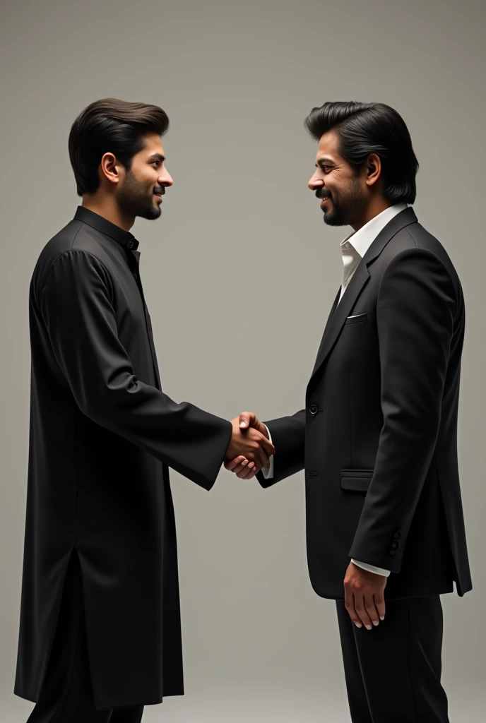 A handsome 1 boy wearing a black shalwar kameez is shaking hands with Shahrukh Khan."