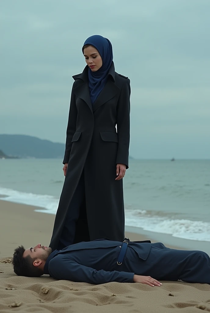 Navy blue headscarf on the beach, black long closed coat, barefoot, Sexy skinny woman. Man lying in front of woman. Woman puts her foot on the front of man's sweatpants.