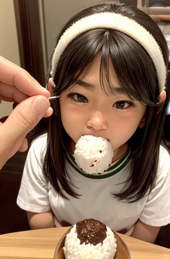 The act of putting an onigiri (rice ball) into one's mouth