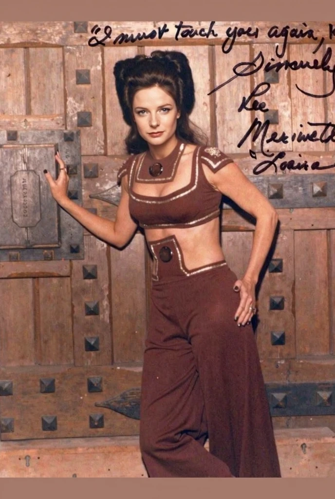 Wilma Flintstone (gates McFadden, age 30, twintails, bone in hair, fur 2 piece outfit, casual pose hands on hip, slightly annoyed) in a Bedrock house with animal appliances
