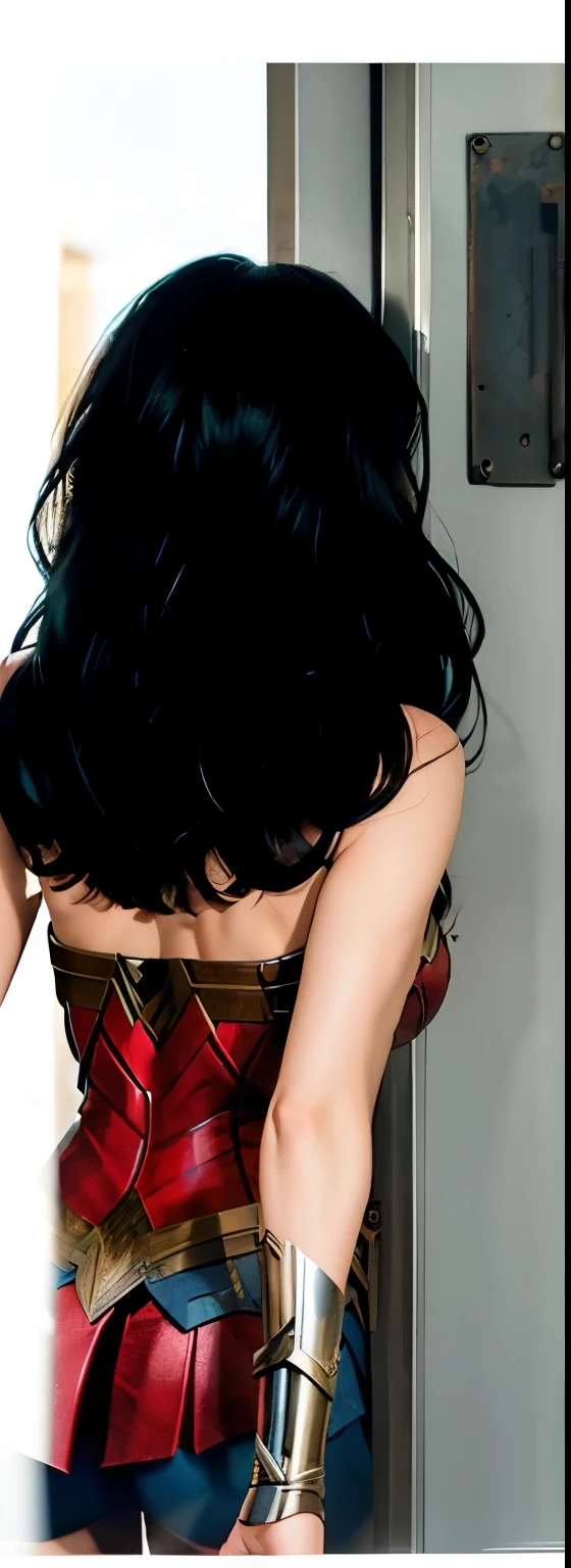 (best quality, masterpiece:1.2) 1girl woman in her 40 years, from behind, long black hair, wonderwoman as gal gadot, metal blacelet, metal room background with metal door and window, realistic