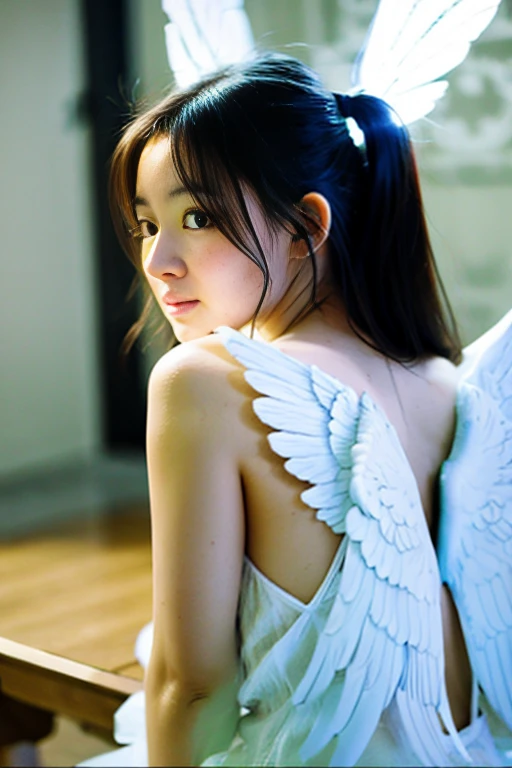 A girl with glowing angel wings on her back