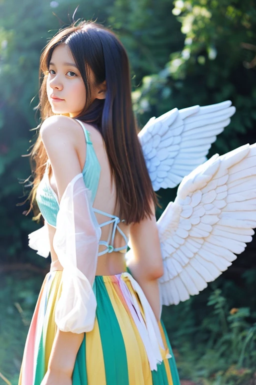 A girl with rainbow-colored angel wings on her back