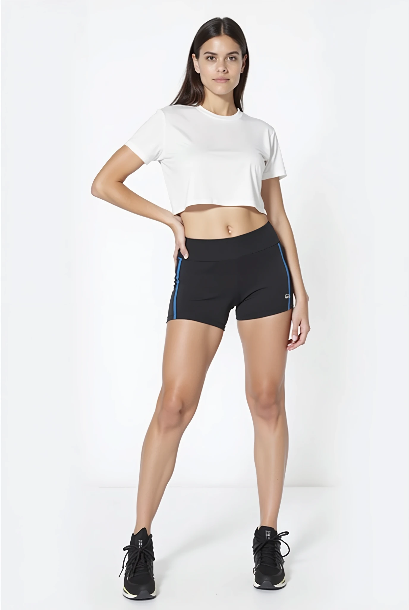 full body portrait with white background facing forward wearing yoga shorts and crop top