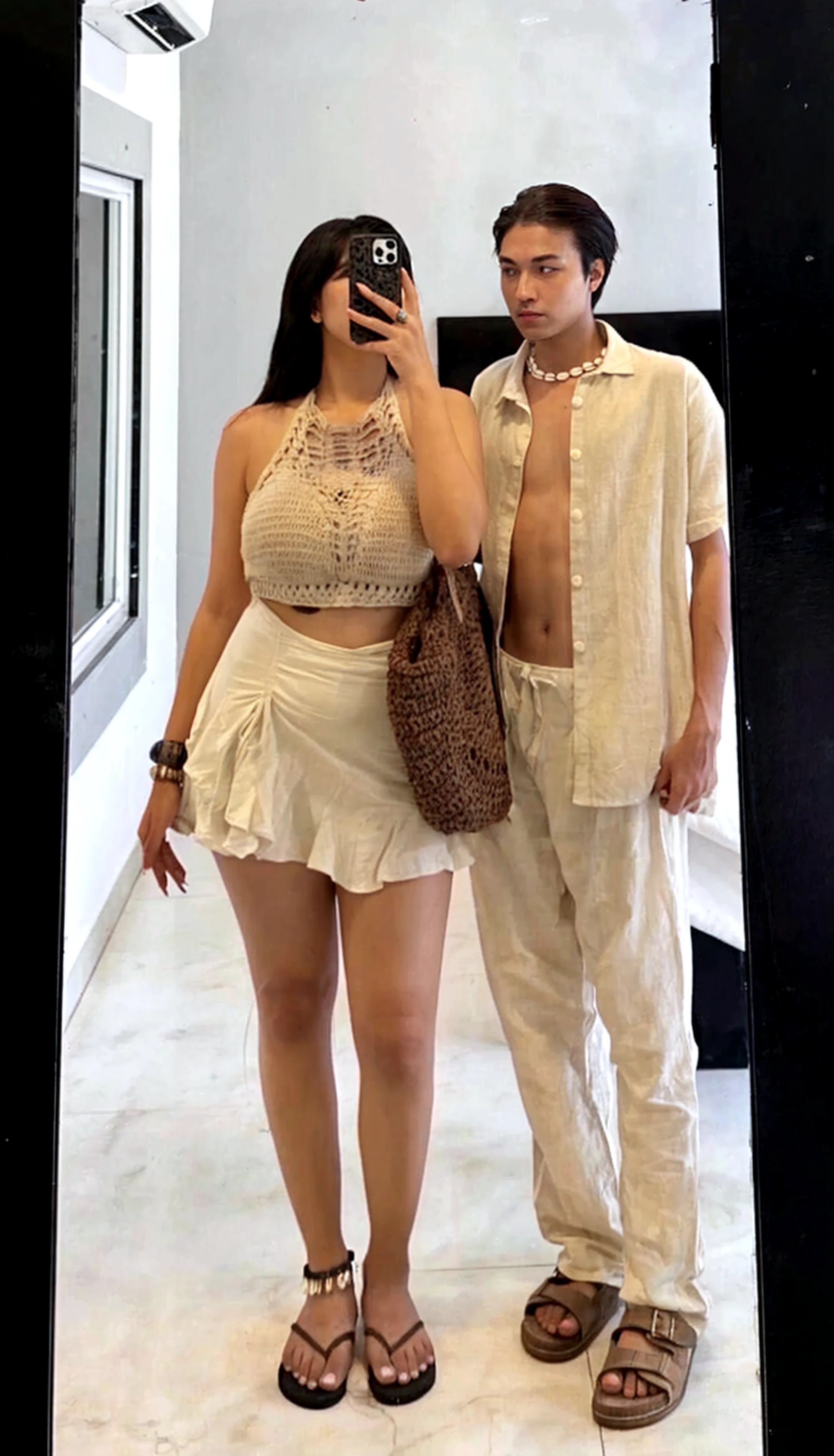 5 feet 5 inches men standing with 5 feet 4 inches girl taking mirror selfie