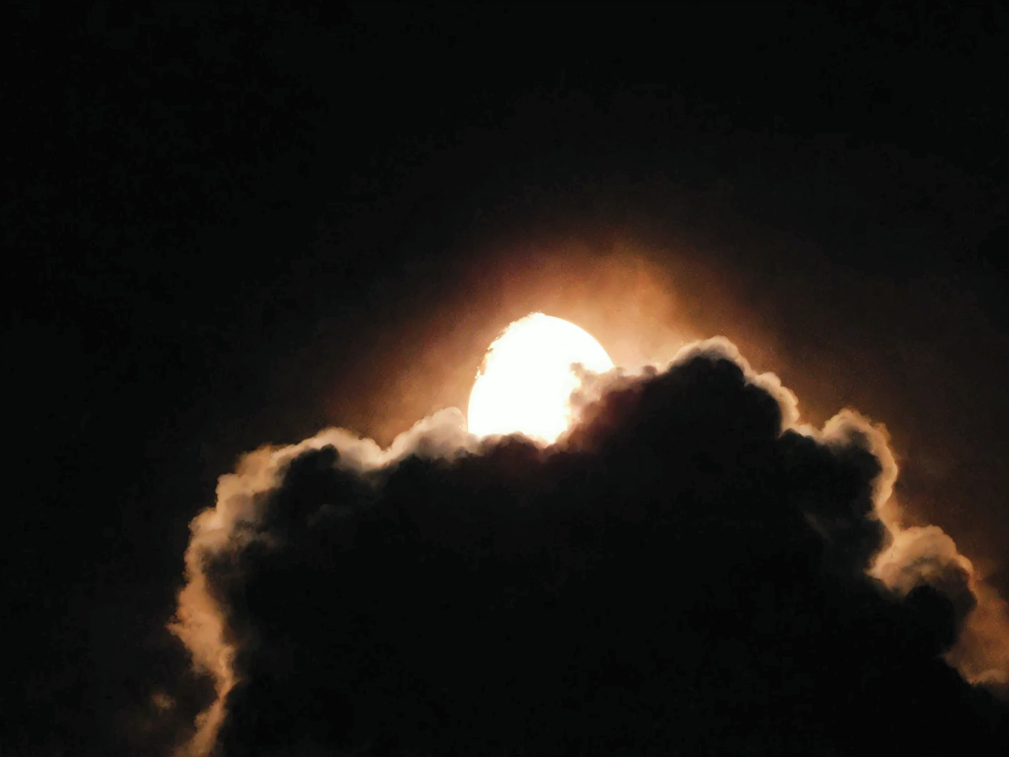 Aerial view of the bright moon shining through the clouds, Full Moon in ...