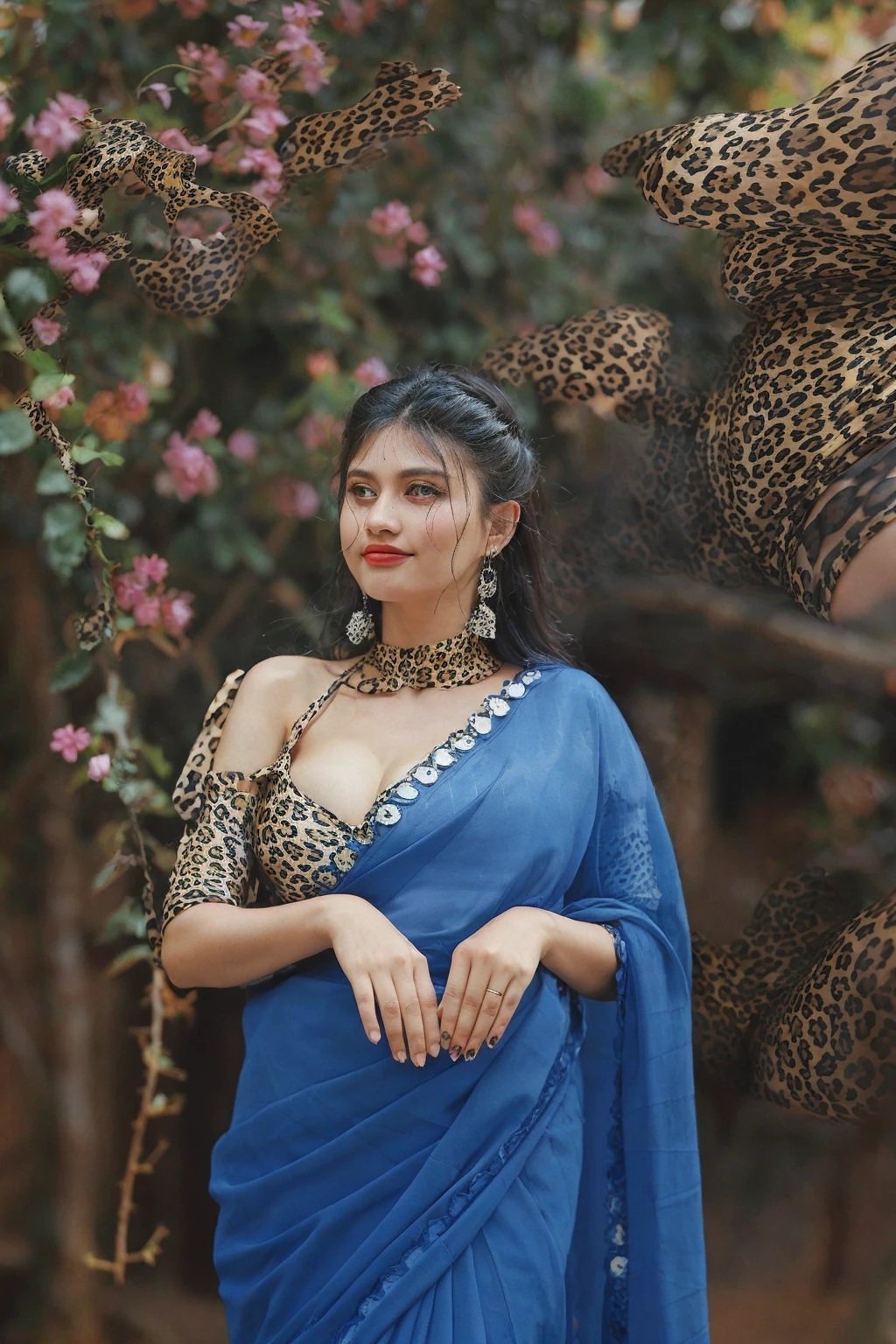 from top view, extreme close up photo of sexy  indian, big cheeks, hourglass figure, swooping breasts, seducing on mountains, ponytail, necklace, sultry, seductive eyes, look at viewer and subtle smile, blue lace night dress, (cinematic:1.3), intricate details, (ArtStation:1.2)