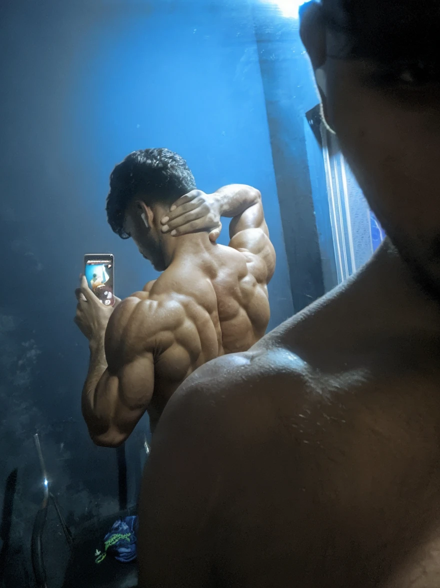 a muscular man with defined abs taking a selfie, wet skin, hot and strong, (best quality,4k,8k,highres,masterpiece:1.2),ultra-detailed,(realistic,photorealistic,photo-realistic:1.37),intricate details, cinematic lighting, dramatic shadows, wet skin, toned body, muscular build, handsome face, intense expression, outdoor setting, summer day