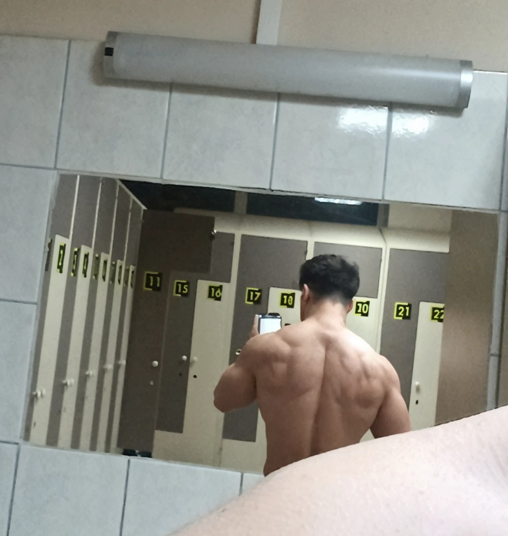 Handsome man , light bears, hot muscular body , medium curly hair , mirror selfie in the bathroom 