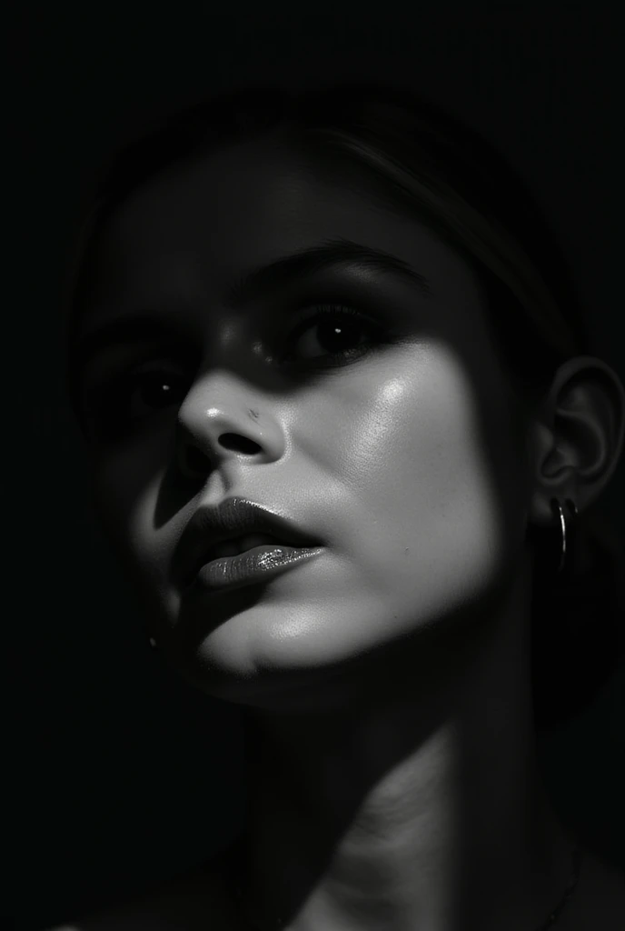 A stunning artistic photograph in which the play of light and shadow creates a mysterious and dramatic atmosphere. The face partially hidden in the shadow of the wall gives the image an intriguing look. Bright eyes and glossy lips stand out against the darkness, drawing attention . High contrast black and white photography, light and shadow lighting, modern digital age, monochromatic palette, conceptual art