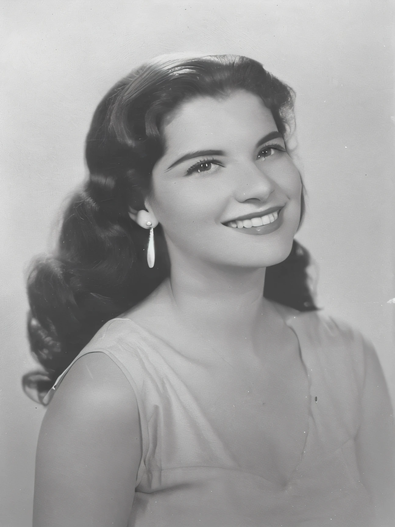 arafed black and white photo of a woman with a smile, in her early 20s, unknown location, photo of a woman, blanca alvarez, in her early 3 0, dolores abernathy, photo 1960, 1 9 4 8 photo, magda torres gurza, photo of young woman, catalog photo, portrait image