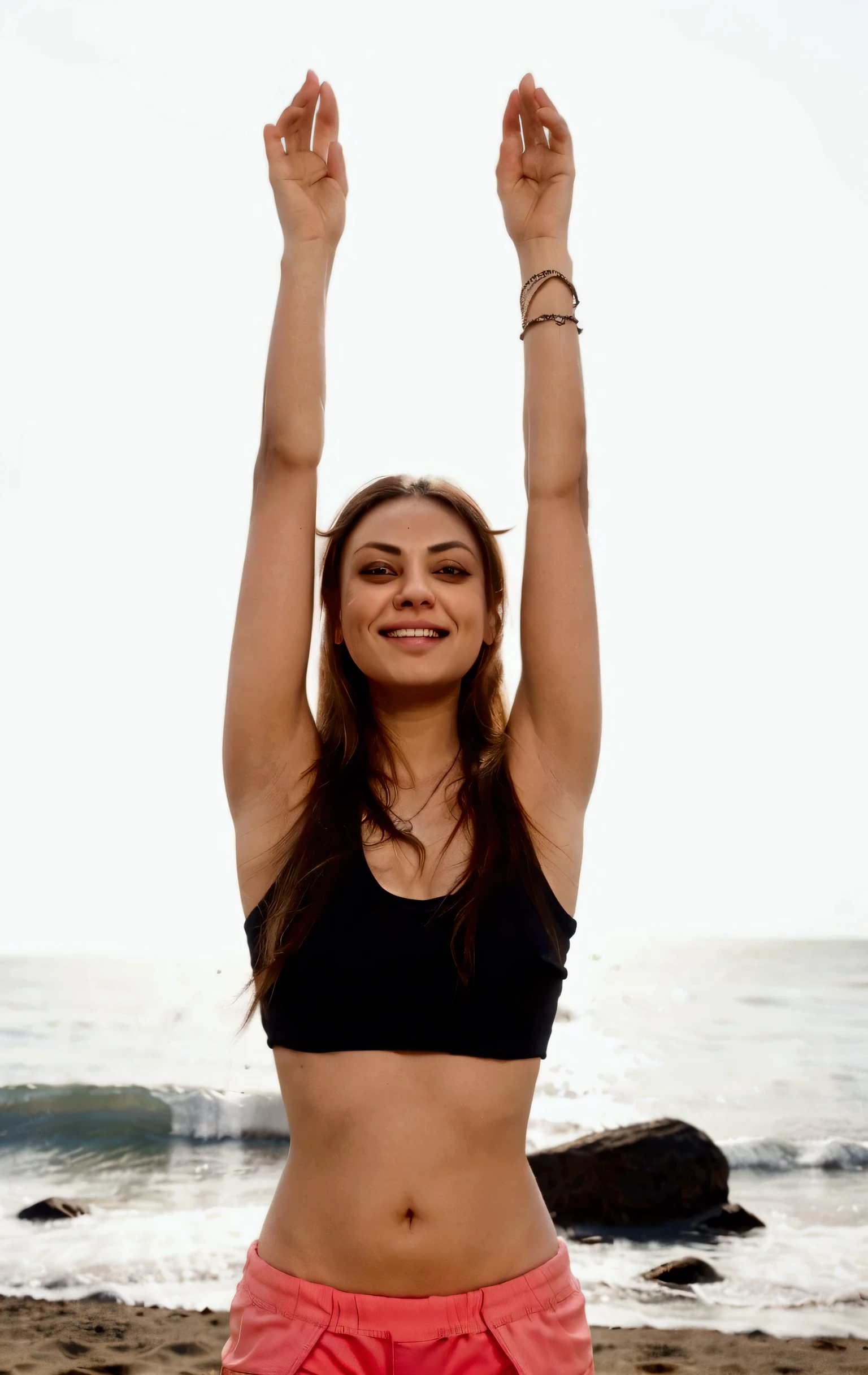 mila kunis in a black top and pink shorts standing on a beach, anjali mudra, with arms up, arms raised, vivid and balanced, lorena avarez, caroline gariba, pose(arms up + happy), aleksandra waliszewska, rising up from ocean, sukhasana, lotus pose, fernanda suarez, triumphant pose, arms spread wide