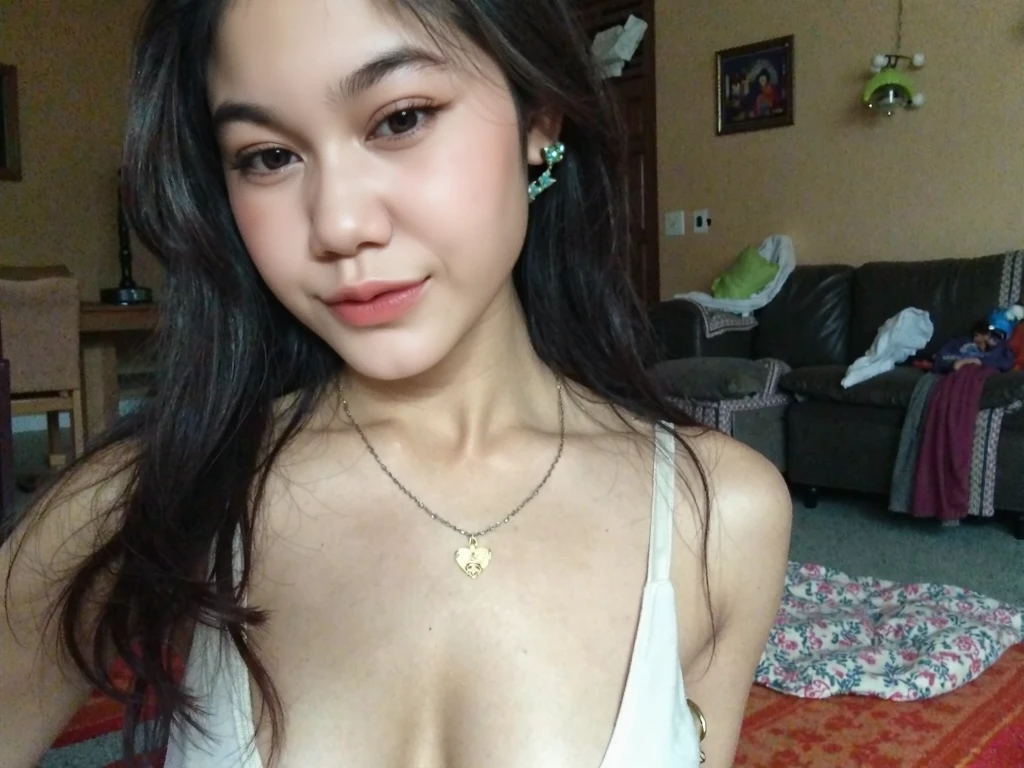 there is a woman with a tattoo on her arm and a tattoo on her arm, sie boob, asian nymph bald goddess, friendly seductive smile, bedroom eyes, sexy look at the camera, young cute wan asian face, bust shot, 3/4 bust, busty, asian girl, 2 7 years old, 2 8 years old, asian hyperdetailed