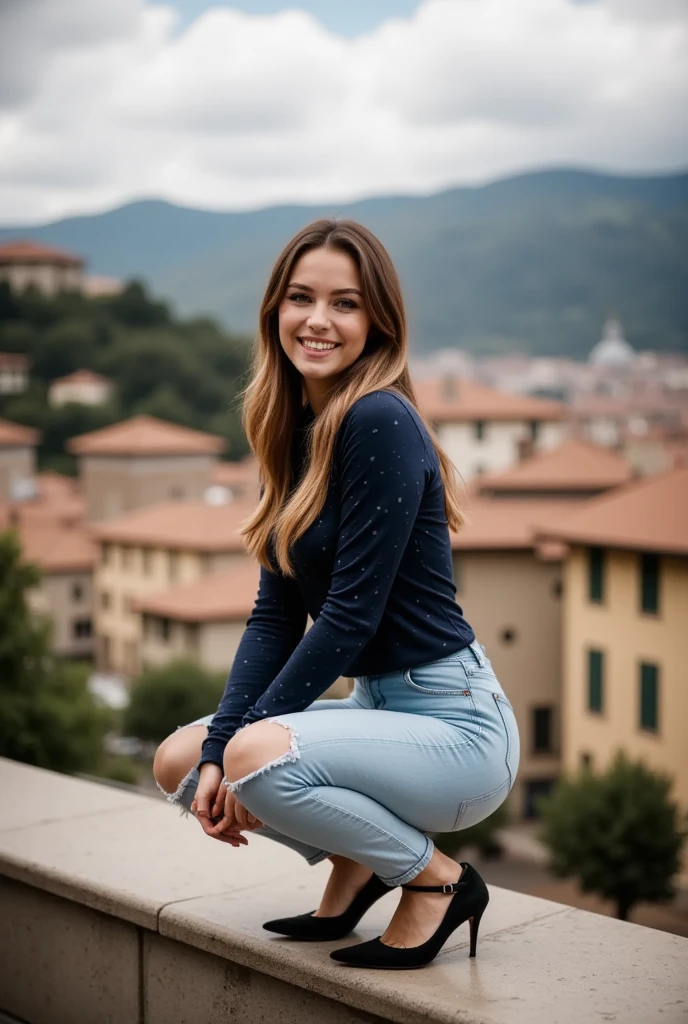 This photograph captures a young woman named maia in an outdoor setting, likely a European city with a backdrop of picturesque, terracotta-roofed buildings and rolling hills. She is positioned on a stone ledge, crouched down with her knees bent and her hands resting on her thighs, exuding a relaxed and confident demeanor. Her long, wavy hair cascades over her shoulders, with a mix of light brown and blonde hues. She is smiling broadly, showcasing her white teeth, and her eyes are sparkling with joy.

She is wearing a fitted, navy blue long-sleeved top with subtle polka dots, which contrasts with her light blue, form-fitting jeans that have a subtle rip on the left knee. Her outfit is complemented by black, pointed-toe high heels with ankle straps, adding a touch of elegance and sophistication. The texture of her jeans appears soft and slightly stretchy, while her top is made of a smooth, slightly shiny fabric.

The background features a hilly landscape with a mix of greenery and buildings, suggesting a serene, picturesque location. The sky above is partly cloudy, adding a natural, earthy tone to the image. The overall mood is one of casual elegance and contentment.