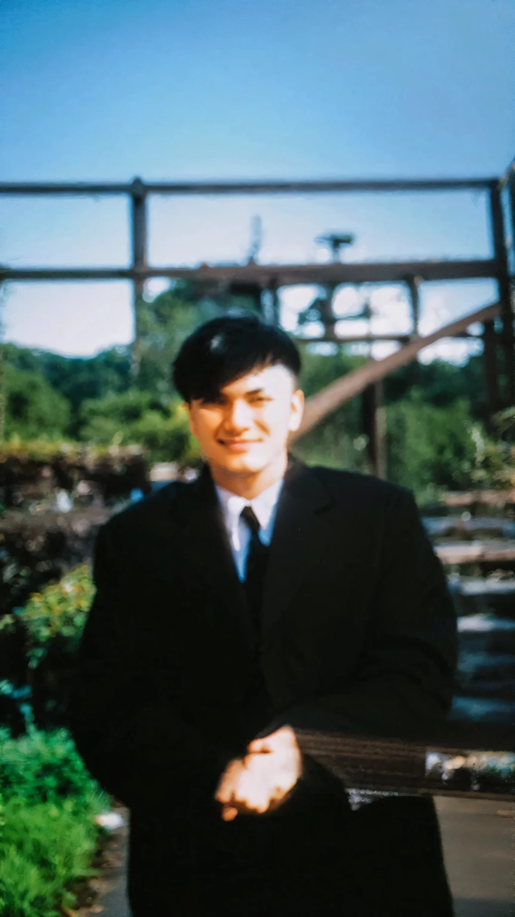 ((((A young man from Hubei Province in a suit, standing in a field of Shanghai greens, about 22 years old, high nose bridge, slightly sunken eye sockets, single eyelids, thin lips, confident and charming smile, flowing and smooth Sanqi hair type, slightly long hair shiny, gray shirt, thin face, slightly light eyebrows, the sun at 1 pm does not open his eyes, perfect facial features and face))))), 0.3 Zheng Yijian's silhouette, 0.3 artist's literary and artistic temperament, excellent temperament, heroic and compelling, full body photo, tall figure, height 180CM, slender neck full body portrait photo, wearing a black aristocratic dark striped suit, full body photo, taken in the early 2023s, warm spring, taken in the late 2022s, (((Full body photo, perfect face, shallow dimples on the left cheek)))), idol drama male protagonist, aristocracy, rich second generation, luxury love clothing, top high-end fabrics and tailoring (((Ultra-delicate and exquisite details portrayal, clear picture, natural lighting of the movie, master photography))