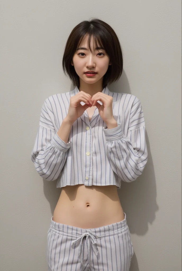 They are wearing off-shoulder pajamas, making a firm big heart shape with both hands, and holding them in front of their chest, View above collarbone、Throat up for a cute smile、Monotone background

