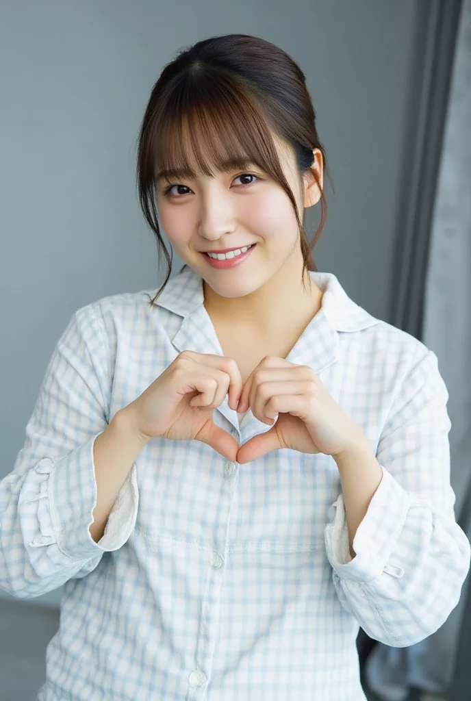 Only one woman with a cute smile is in a pose wearing off-shoulder pajamas, making a firm big heart shape with both hands, and holding them in front of her chest, View above collarbone、The background is a monotone 

