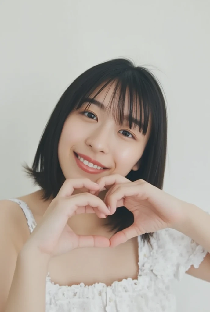 Only one woman with a cute smile is in a pose wearing off-shoulder pajamas, making a firm big heart shape with both hands, and holding them in front of her chest, View above collarbone、The background is a monotone 

