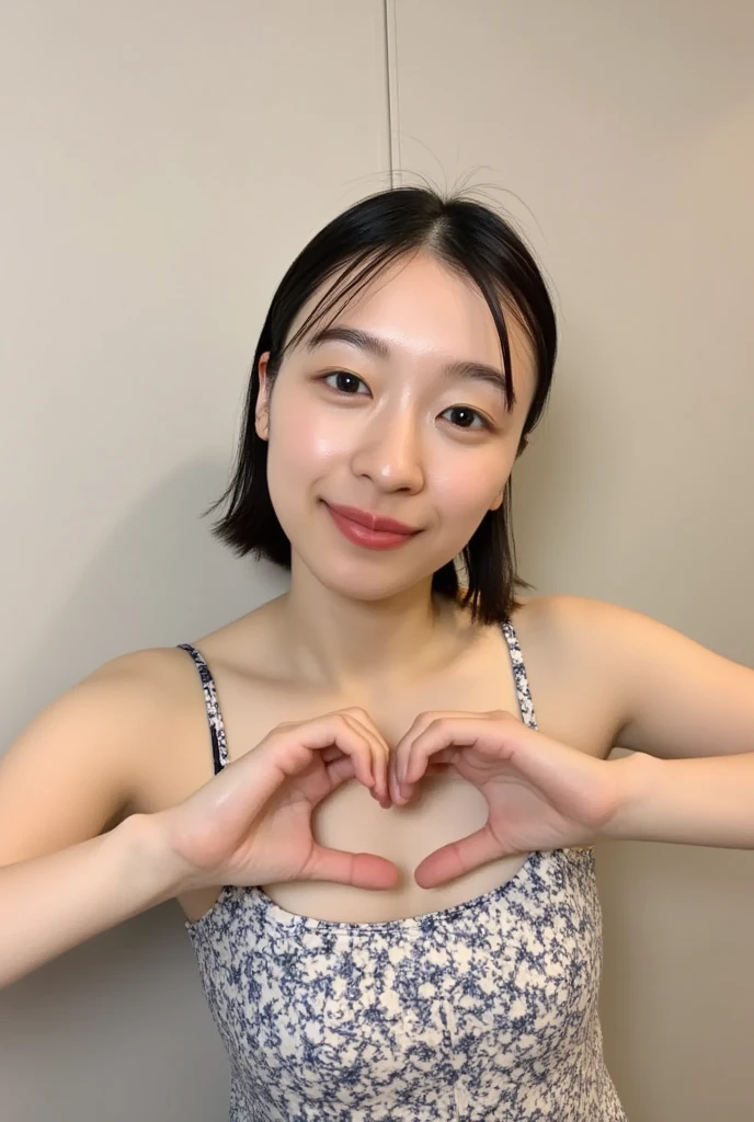 Only one woman with a cute smile is in a pose wearing off-shoulder pajamas, making a firm big heart shape with both hands, and holding them in front of her chest, View above collarbone、The background is a monotone 

