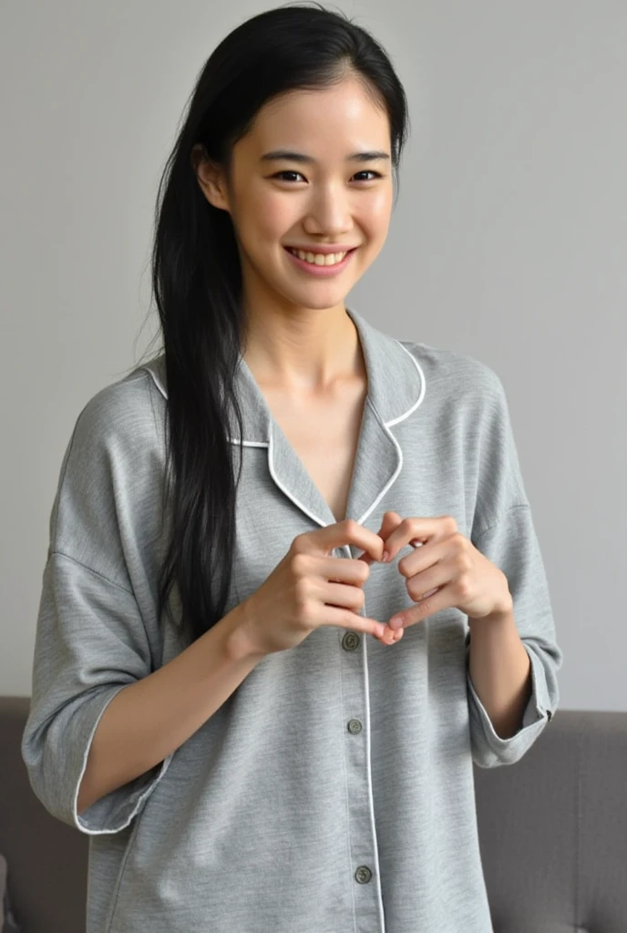 Only one woman with a cute smile is in a pose wearing off-shoulder pajamas, making a firm big heart shape with both hands, and holding them in front of her chest, View above collarbone、The background is a monotone 

